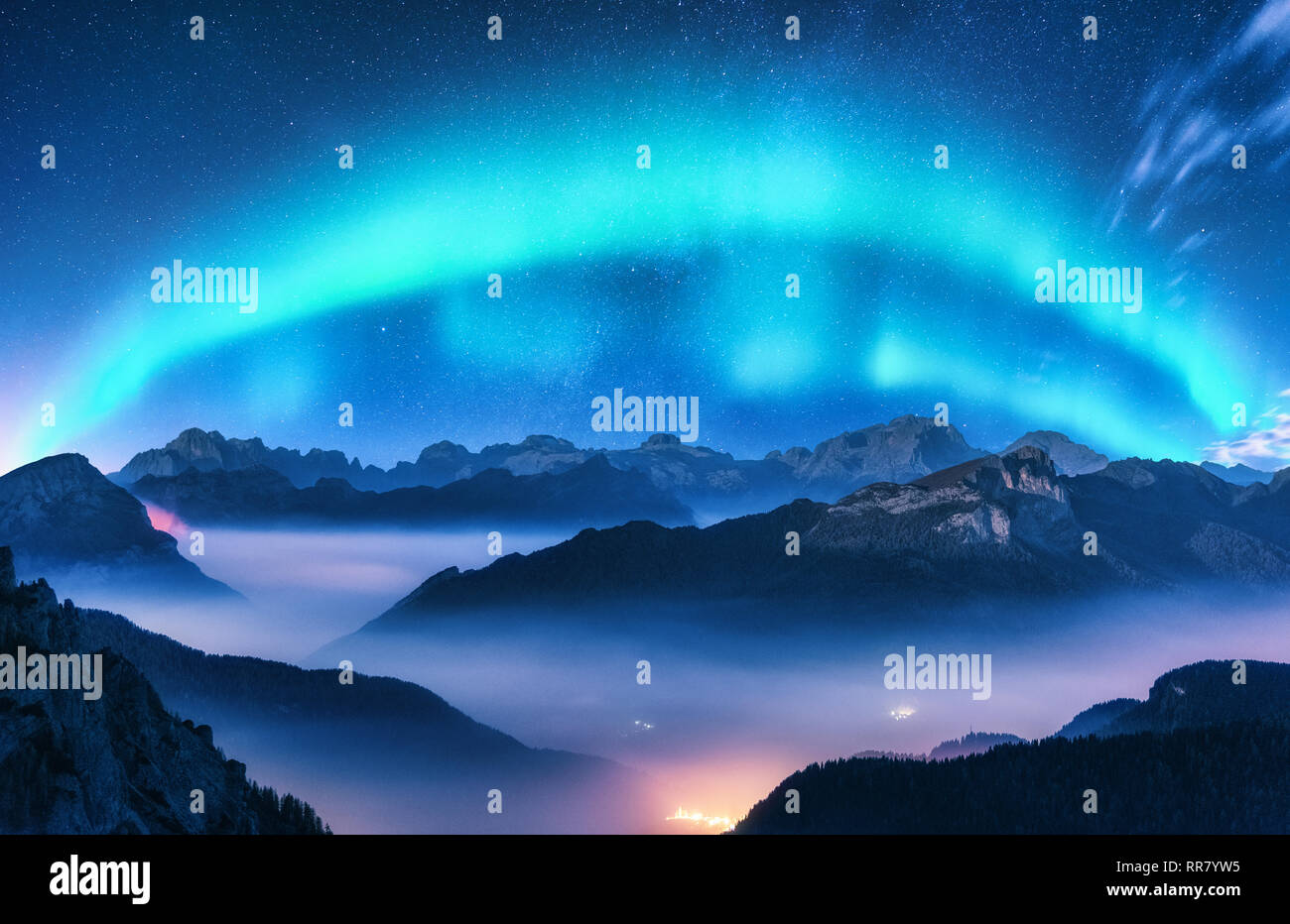 Aurora Borealis Above Mountains In Fog At Night Northern Lights Sky With Stars With Polar Lights And High Rocks Beautiful Landscape With Aurora Ci Stock Photo Alamy