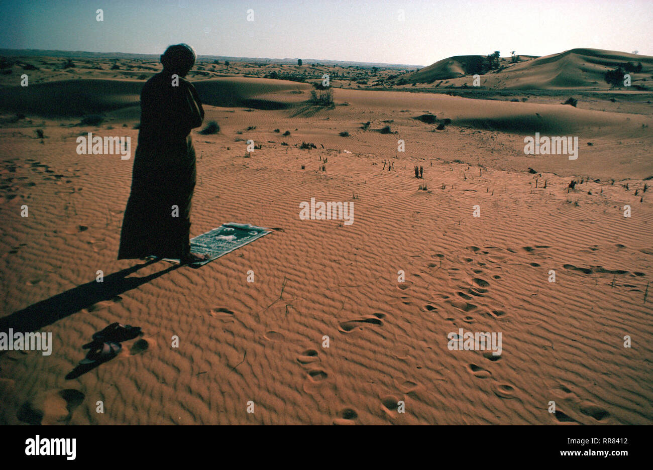 An Arab man faces the direction of Mecca to offer afternoon prayer