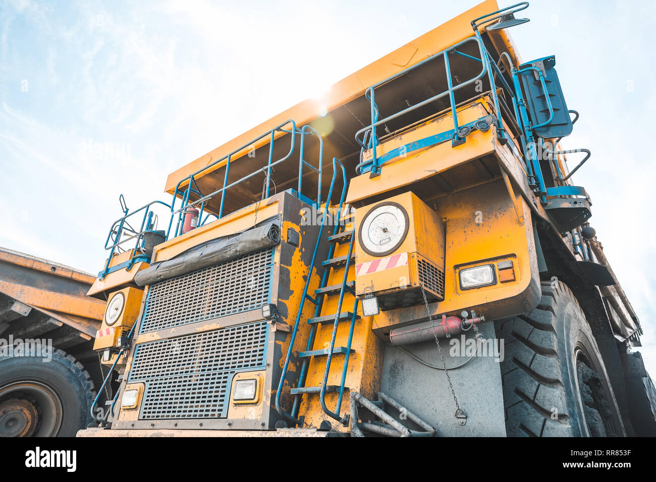 Large quarry dump truck. Loading the rock in dumper. Loading coal into