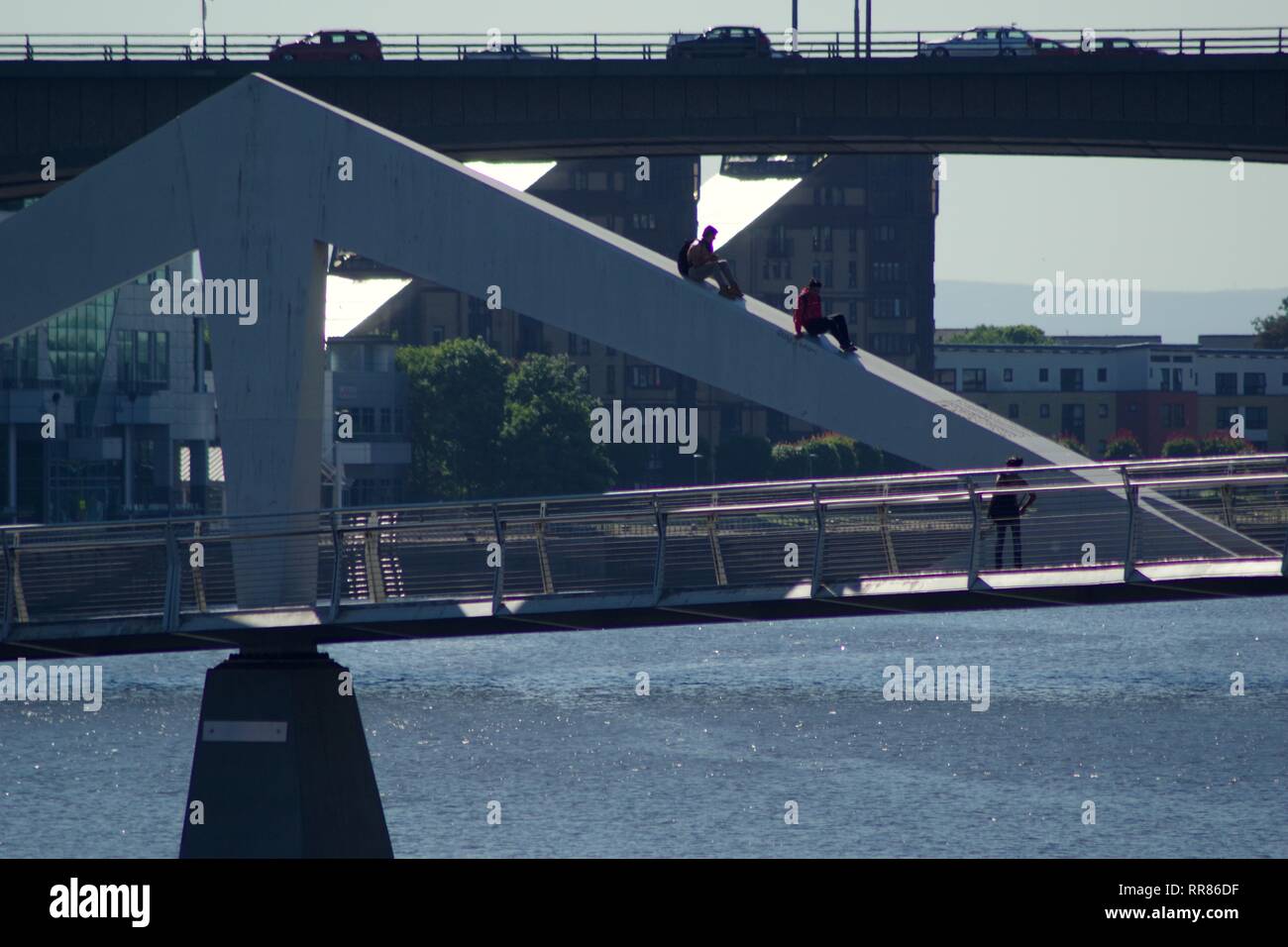 People Climbing the Tradeston Bridge, Pedestrian Bridge over the River Clyde, Glasgow, Scotland, UK. Summer. Stock Photo