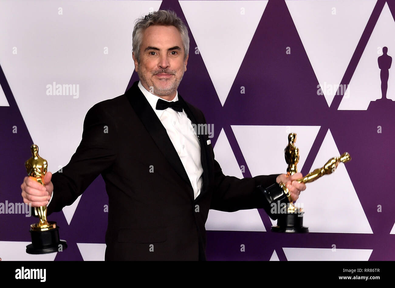 Alfonso Cuaron with his Best Director, Best Foreign Film and Best