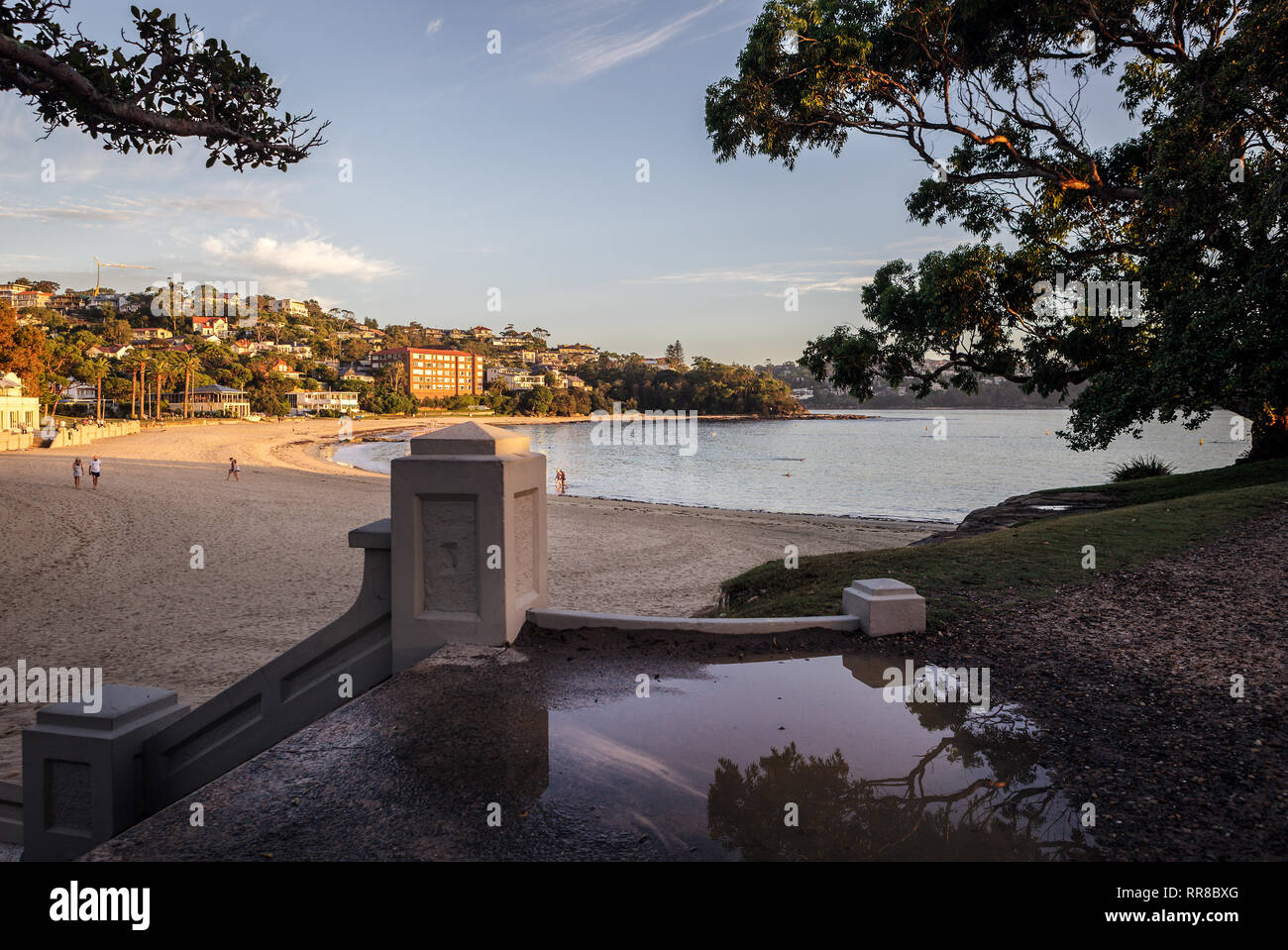 Balmoral Beach. The early morning sun and warmth of a summers morning brings so many people to the beach. A walk, swim or to meditate all enjoy! Stock Photo