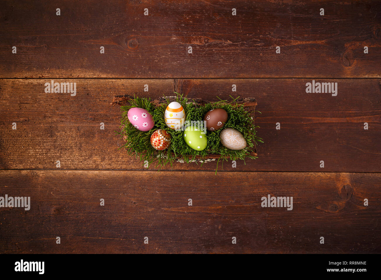 Easter eggs lying on green spring grass, space for your text Stock Photo