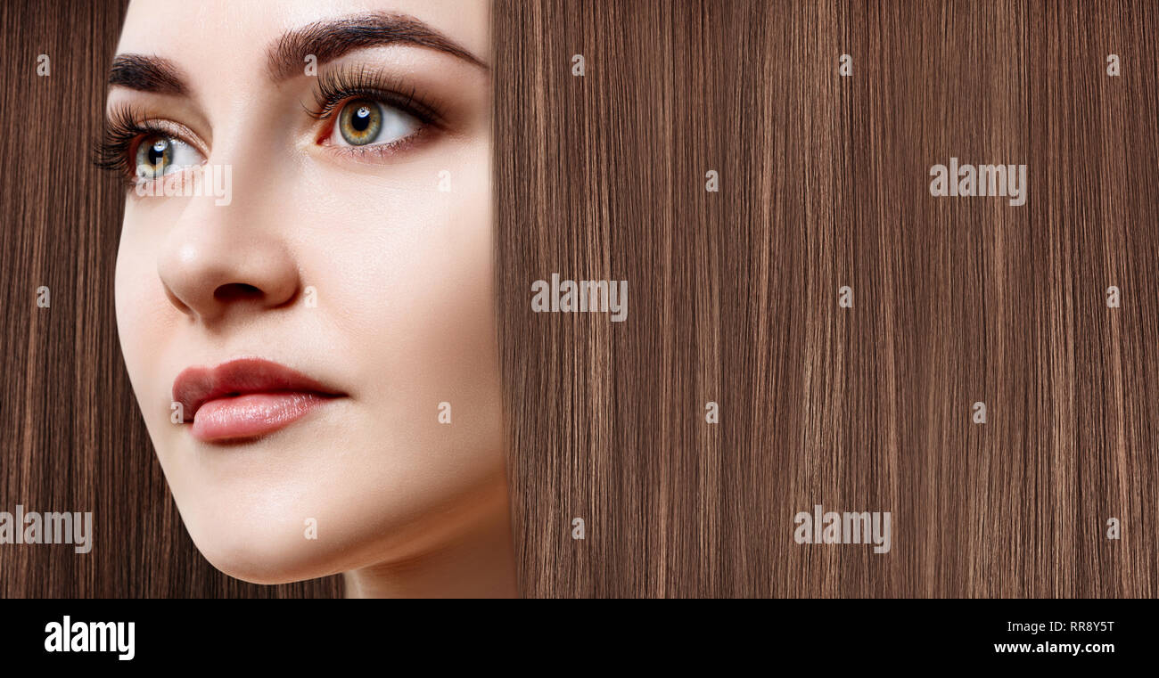 Woman with luxurious long brown hair as background. Stock Photo