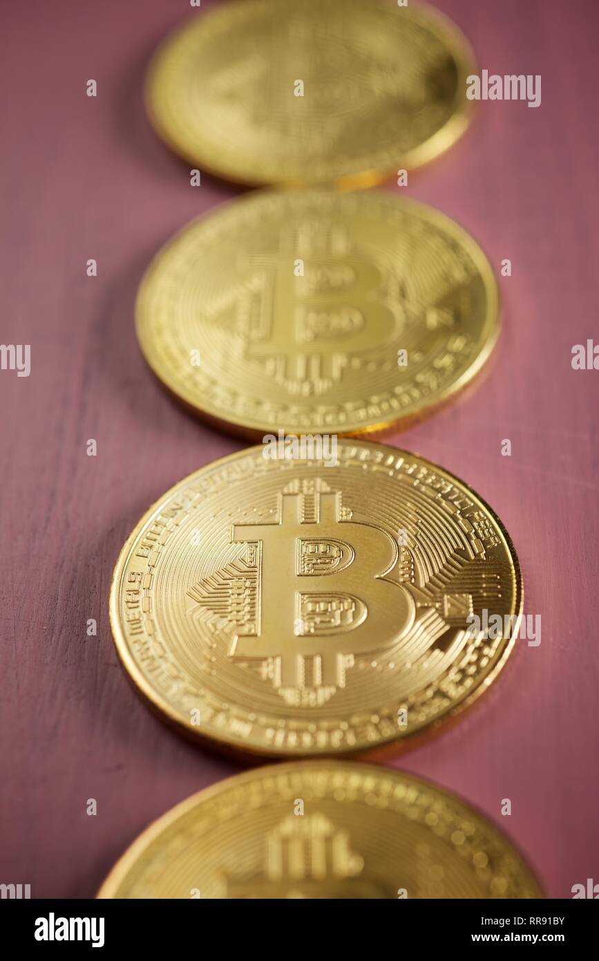 Bitcoins on a wood table. Stock Photo