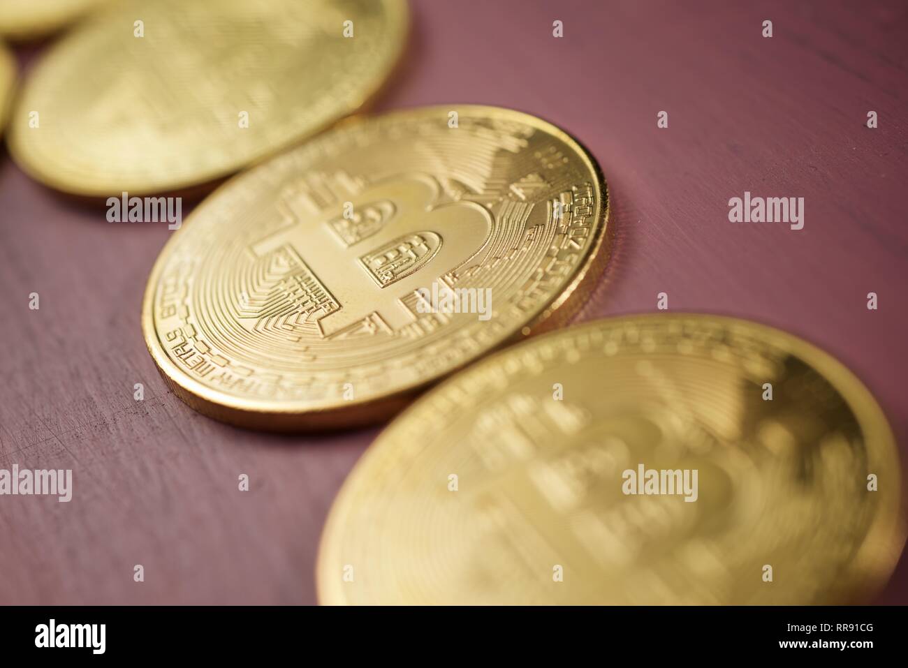 Bitcoins on a wood table. Stock Photo
