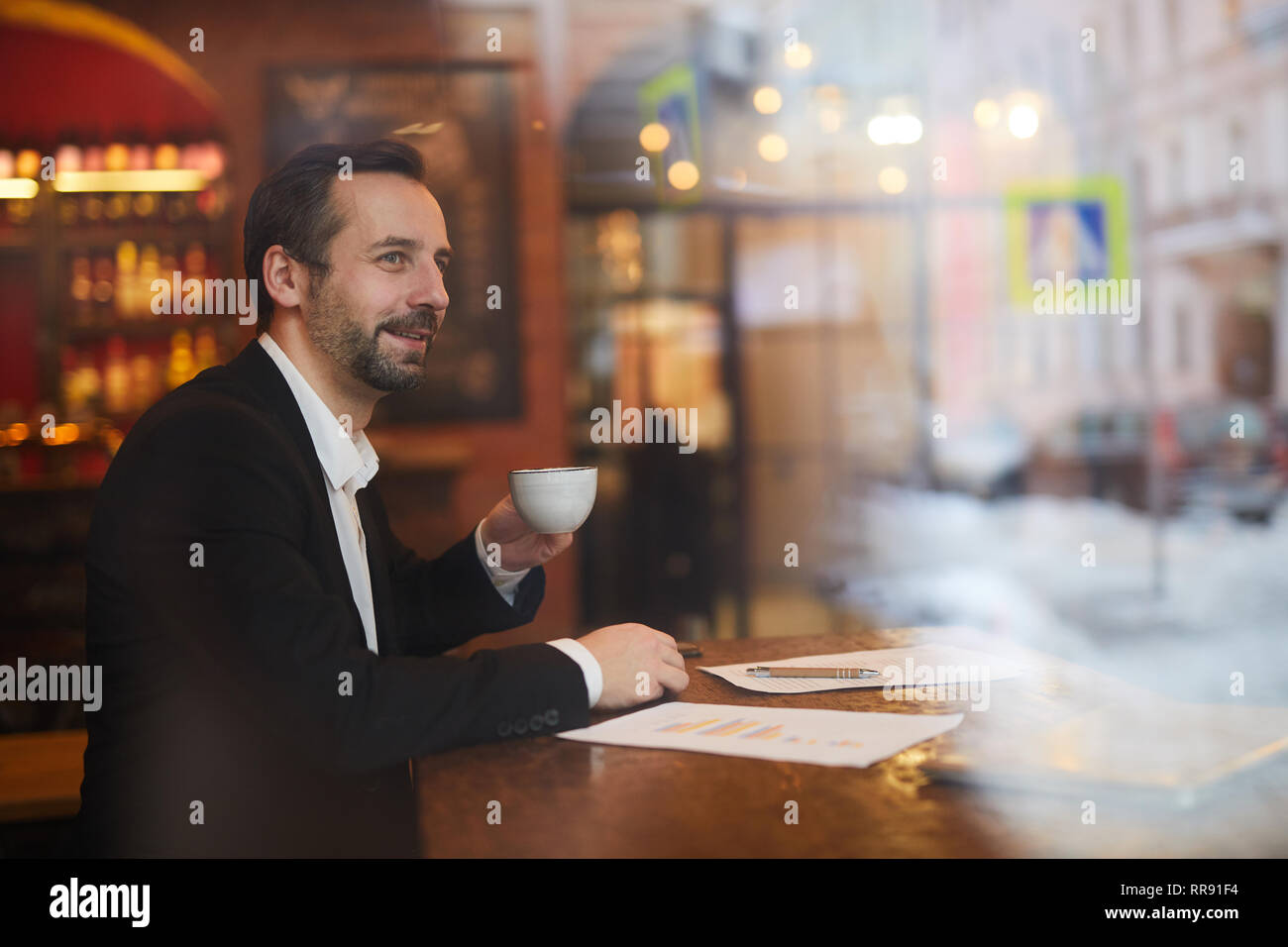 Pensive Businessman in Cafe Stock Photo
