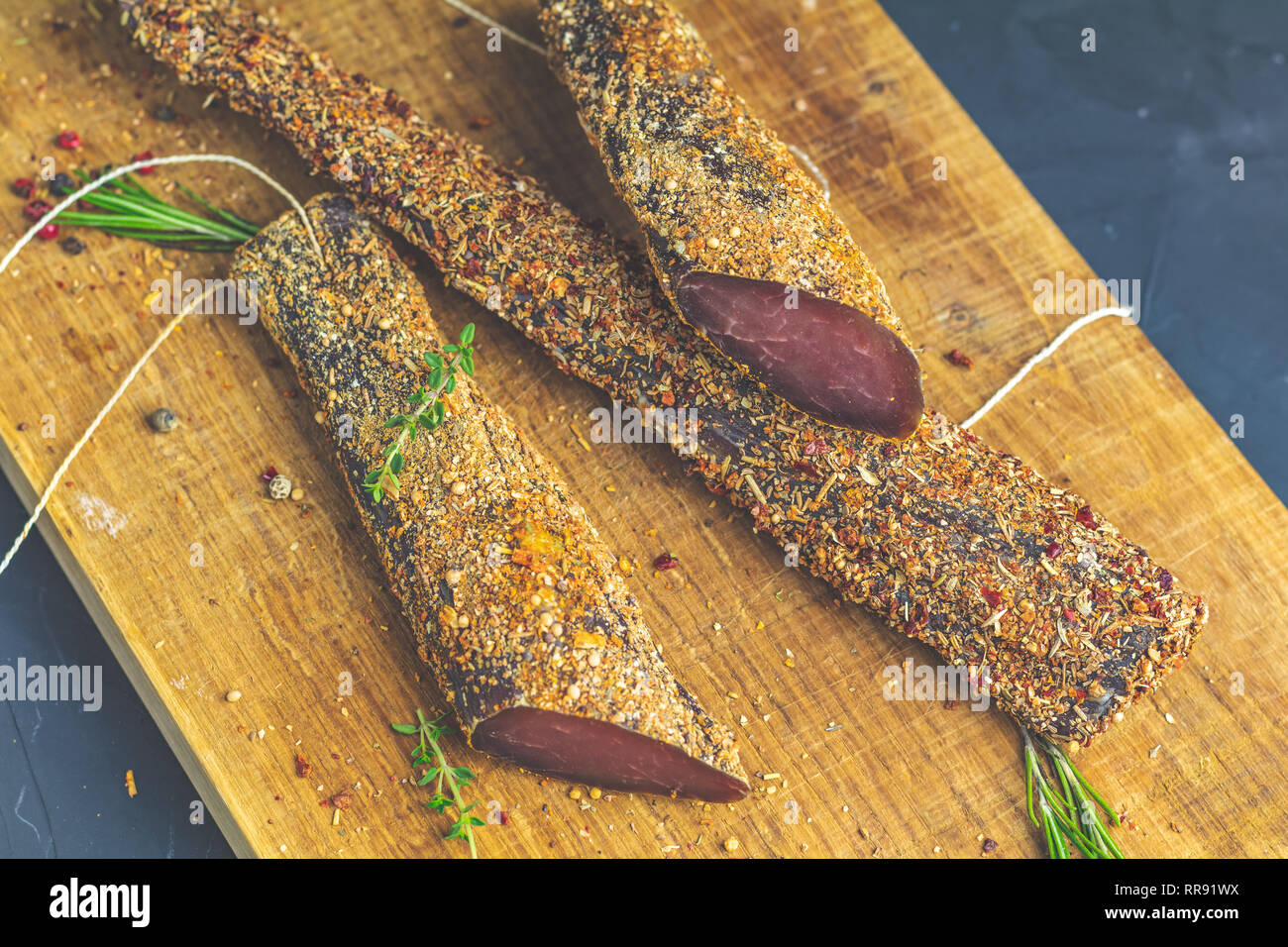 Jerky, basturma, dried meat beef, meat smoked jerky with spices on