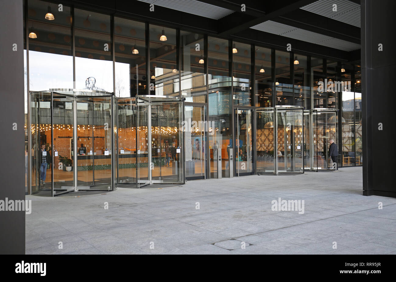 Entrance to Amazon's anonymous new UK headquarters building in London at Principal Place, near Liverpool Street. Shows residential tower to right. Stock Photo