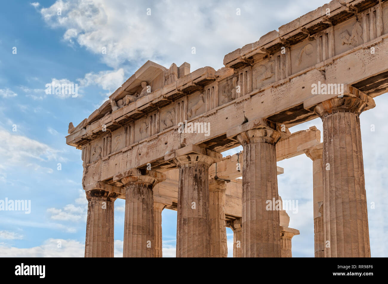 Fragment of the Parthenon with statues, an archaic temple located on the Acropolis of Athens, built in 438 BC in Athens, Greece Stock Photo