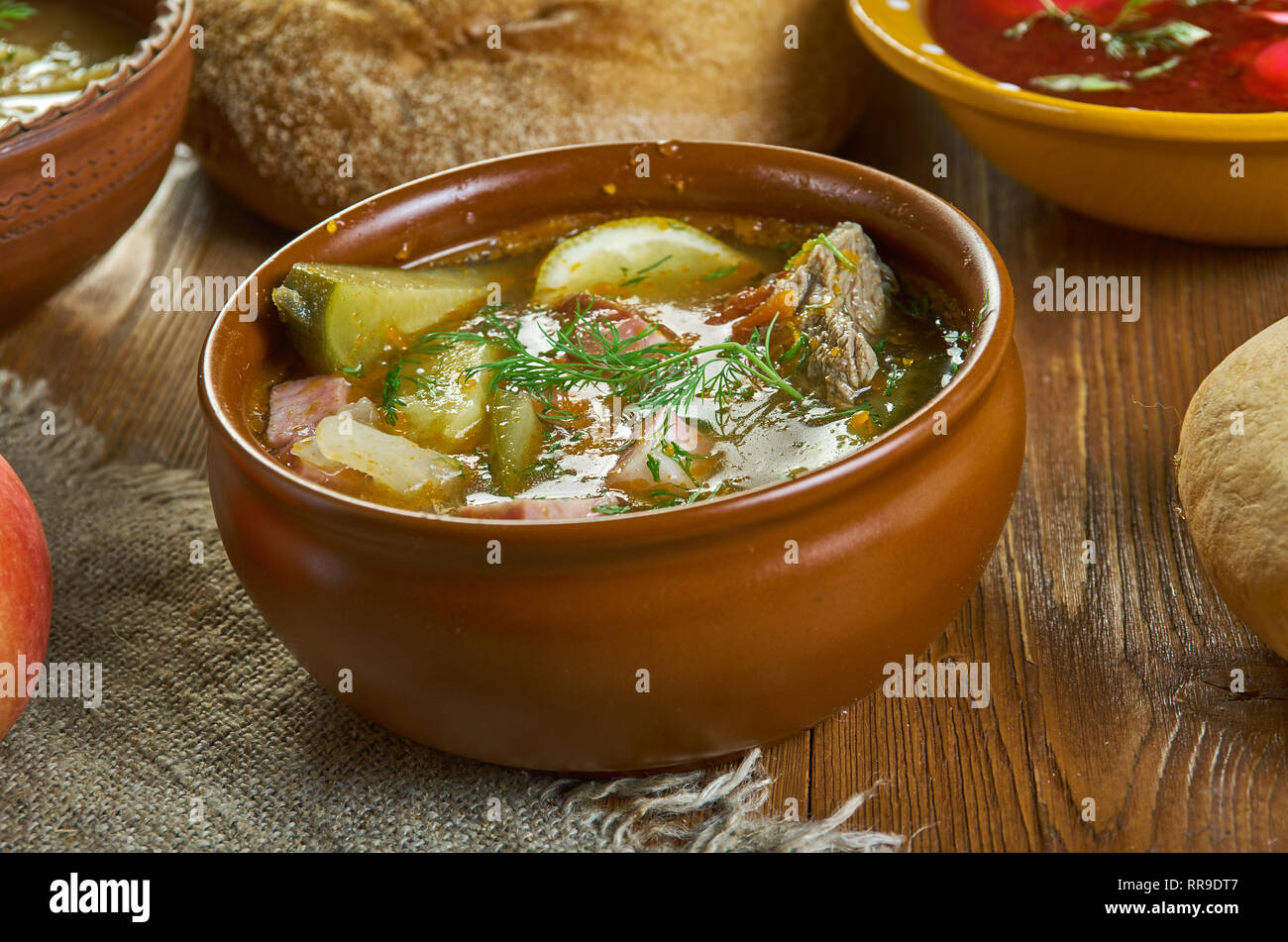 Solyanka, Russian traditional soups , assorted dishes, Top view.contain pickled cucumbers with brine, and often cabbage, salted mushrooms, potatoes, s Stock Photo