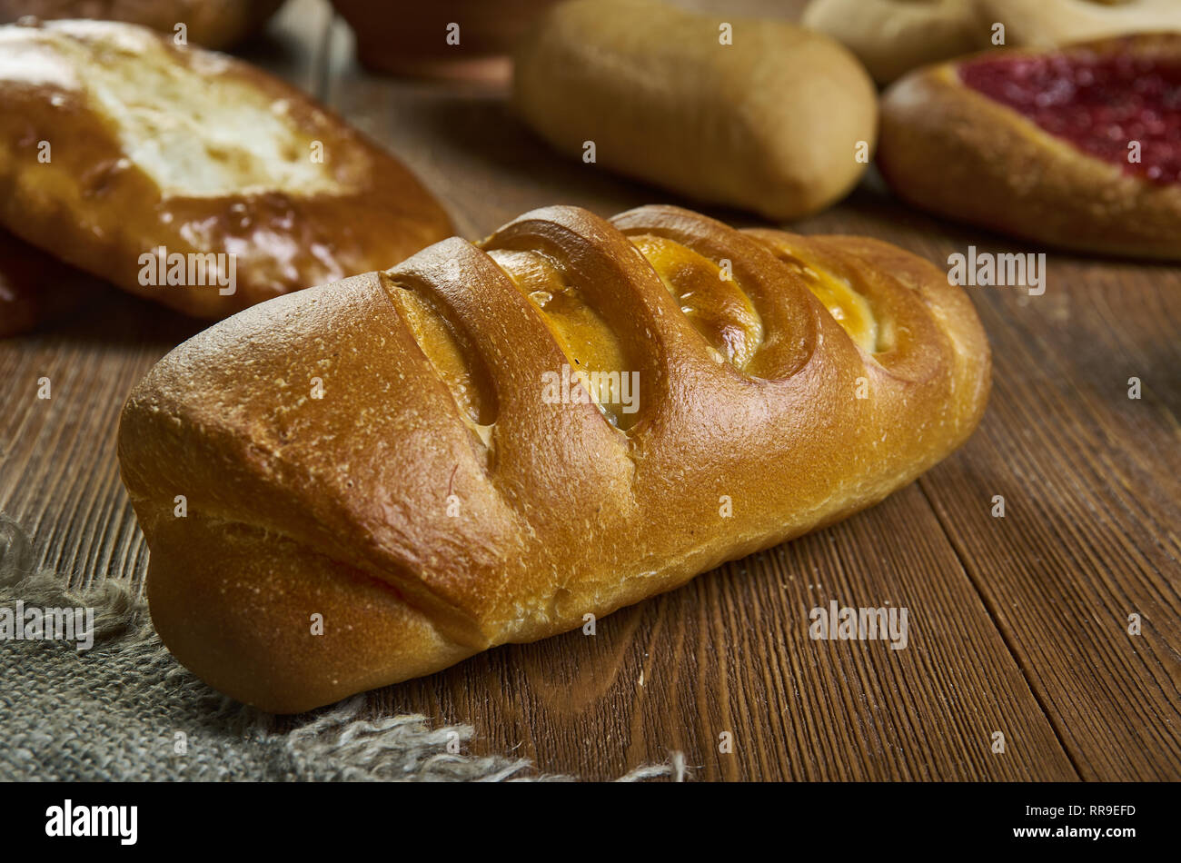 Homemade Russian pie Kurnik with chicken, potatoes and onions close-up on a  slate board on the table. horizontal Stock Photo - Alamy