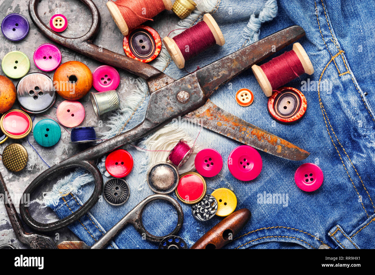 Threads and sewing accessories.Sewing threads, fabric and buttons Stock Photo