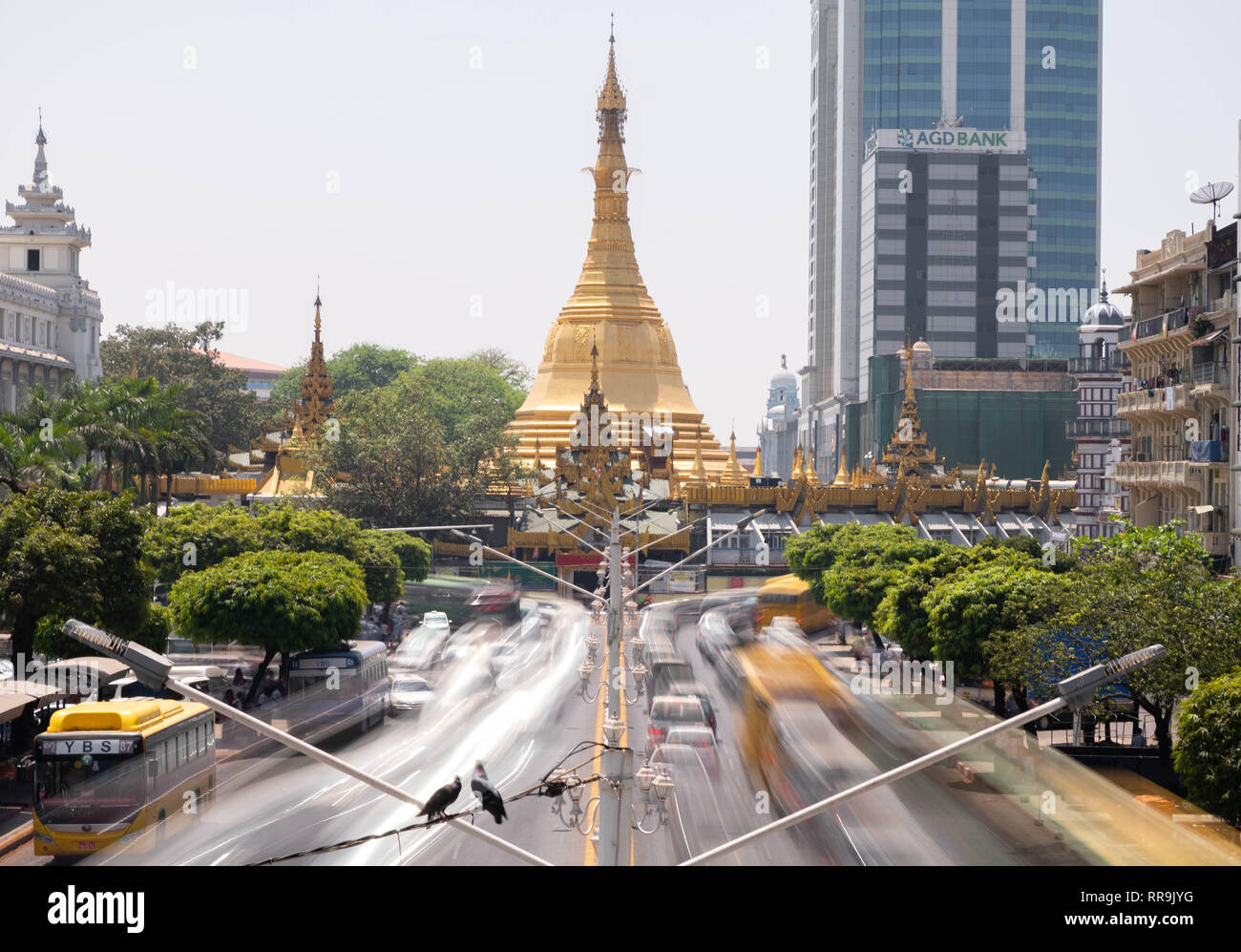 Long exposure of the traffic around the roundabout Sule Pagoda, Yangon, Myanmar Stock Photo