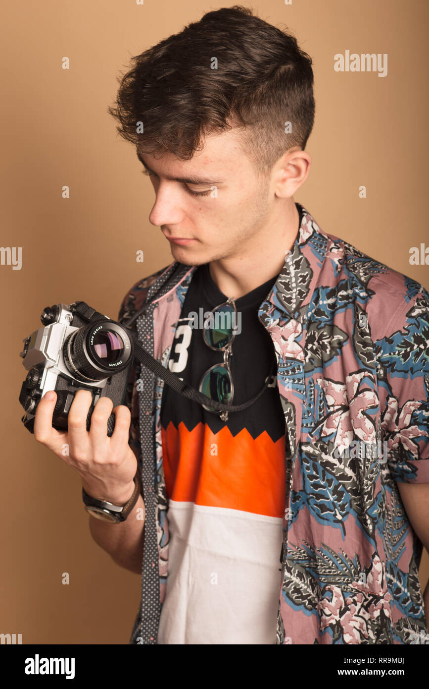 Photographer with an analogue SLR in a studio. Stock Photo