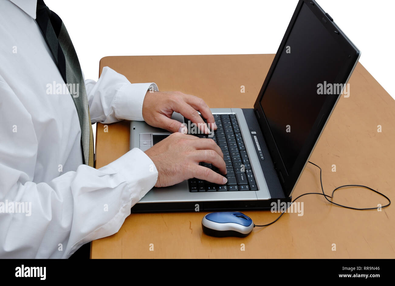 Young businessman in a white shirt with laptop in the office Stock Photo