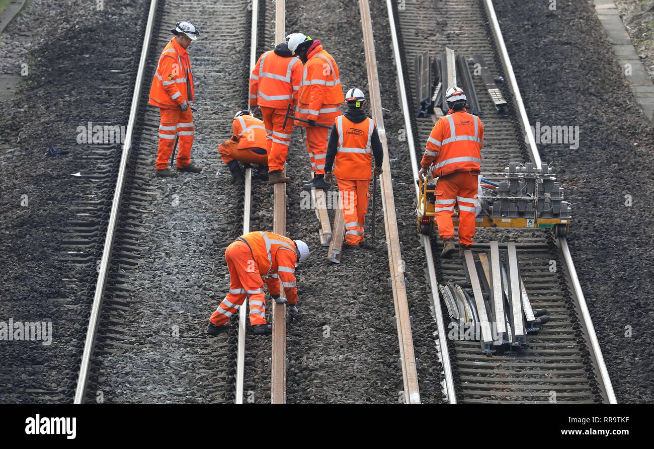 Network Rail engineers work on the track at the Southern end of the Brighton Main Line. The improvement works on the Brighton Main Line are a key part of a £300 million government-funded programme to tackle delay hotspots and boost the reliability of the railway in the south east, including the expanded Thameslink network. The Brighton Main Line is a key rail route, connecting Gatwick Airport and the south coast with London, and is used by 300,000 people each day. 20 February 2019 Stock Photo
