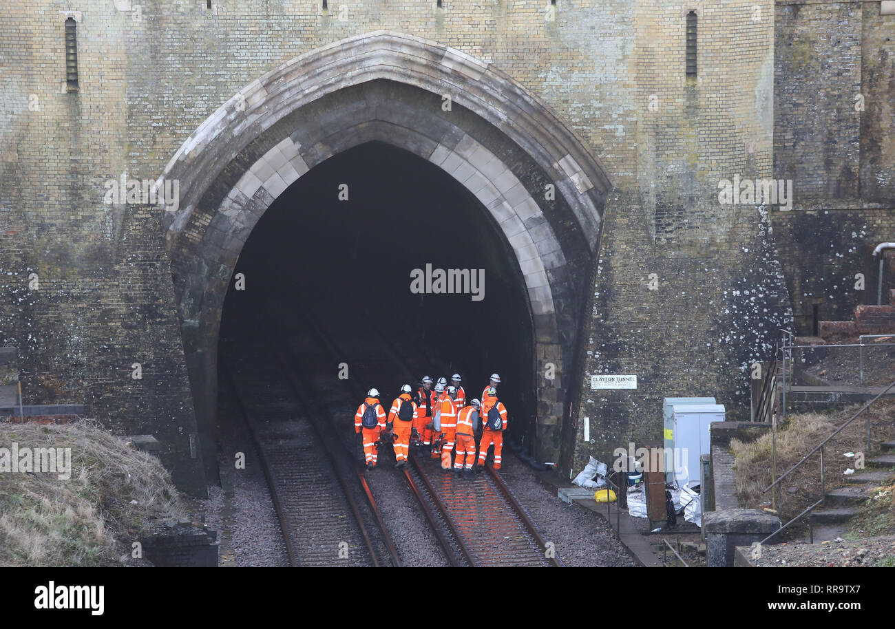 Network Rail engineers work on the track at North entrance to Clayton tunnel on the Brighton Main Line. The 1 mile 506 yard long tunnel is the longest tunnel on the line and was completed in 1841 The improvement works on the Brighton Main Line are a key part of a £300 million government-funded programme to tackle delay hotspots and boost the reliability of the railway in the south east, including the expanded Thameslink network. The Brighton Main Line is a key rail route, connecting Gatwick Airport and the south coast with London, and is used by 300,000 people each day. 20 February 2019 Stock Photo