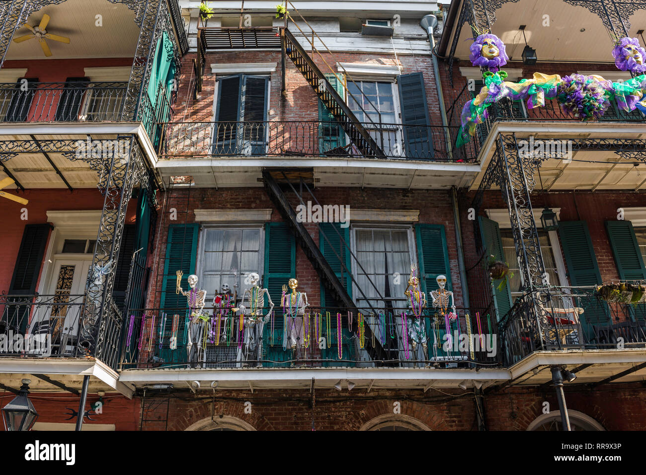 Mardi Gras New Orleans, view of skeletons and colorful throws (beads) decorating a balcony during Mardi Gras in the French Quarter, New Orleans, USA Stock Photo