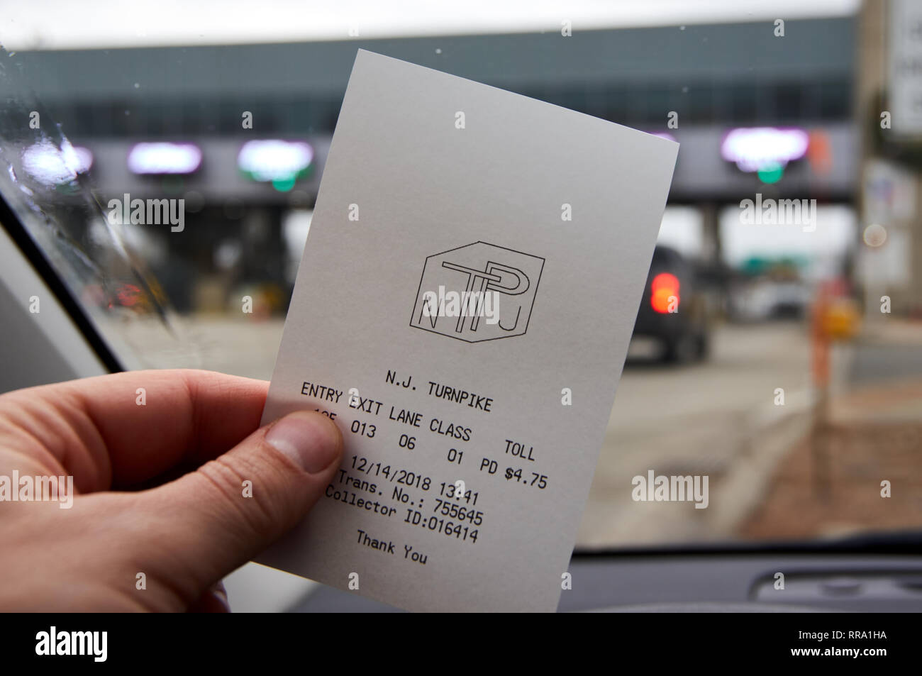 NEW YORK, USA DECEMBER 14, 2018 A hand holding EZPass receipt. E