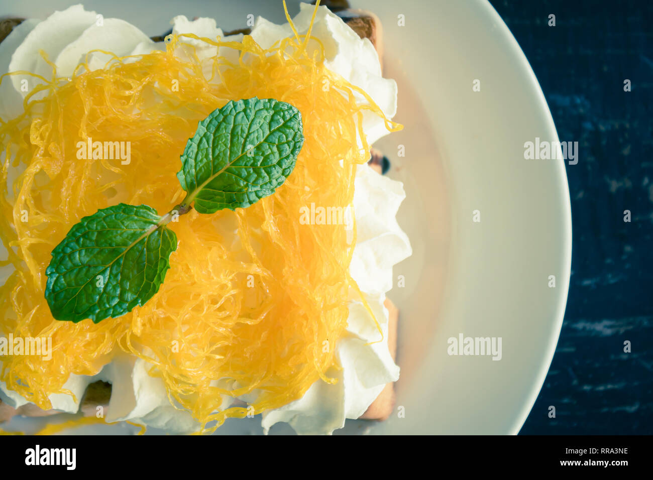 Golden Egg Yolk Threads or Foi Thong Toast and Whipped Cream and Chocolate. Thai dessert golden