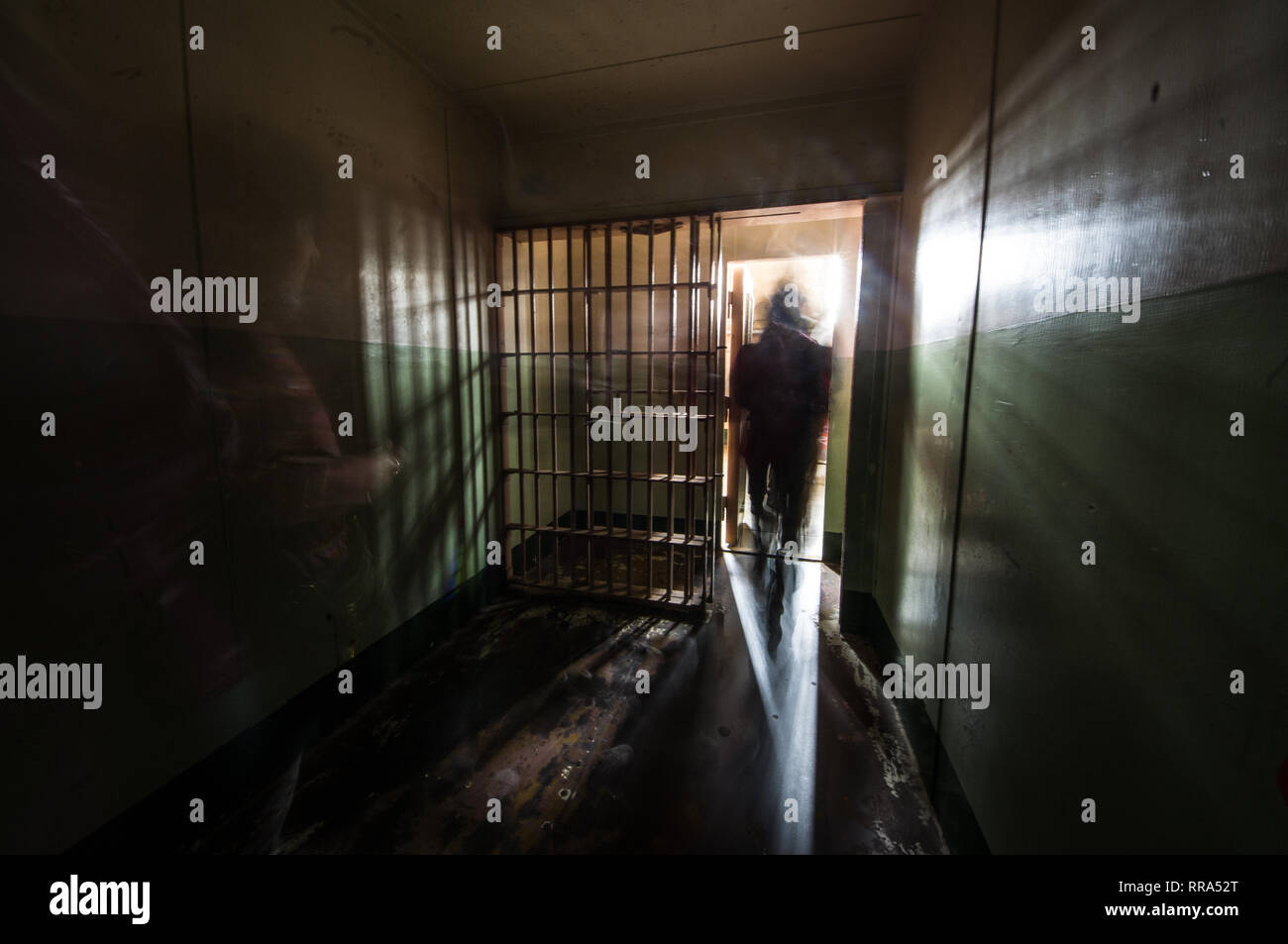 People going out Inside a Jail Cell in Alcatraz Island Prison in San