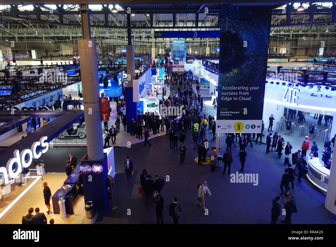 Barcelona, Spain. 25th Feb, 2019. People are seen at the venue of the 2019 Mobile World Congress (MWC) in Barcelona, Spain, Feb. 25, 2019. The four-day 2019 MWC opened on Monday in Barcelona. Credit: Guo Qiuda/Xinhua/Alamy Live News Stock Photo