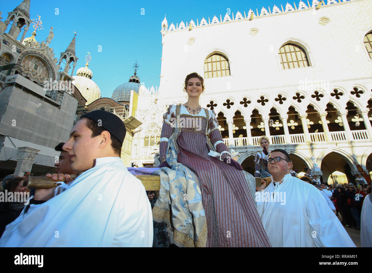 Venice, Italy. 23rd Feb, 2019. The homage that the Doge brought annually to twelve beautiful Venetian girls, giving them generously for the marriage with the dogali jewels has been renewed today with the 'Festa delle Marie', an appointment of the Venetian tradition. The event started in the early afternoon with the girls' parade, accompanied by historical costumed groups, from San Piero di Castello along Riva degli Schiavoni to the stage of Piazza San Marco where the official presentation of the Carnival from part of Prince Maurice Agosti. Credit: Independent Photo Agency/Alamy Live News Stock Photo