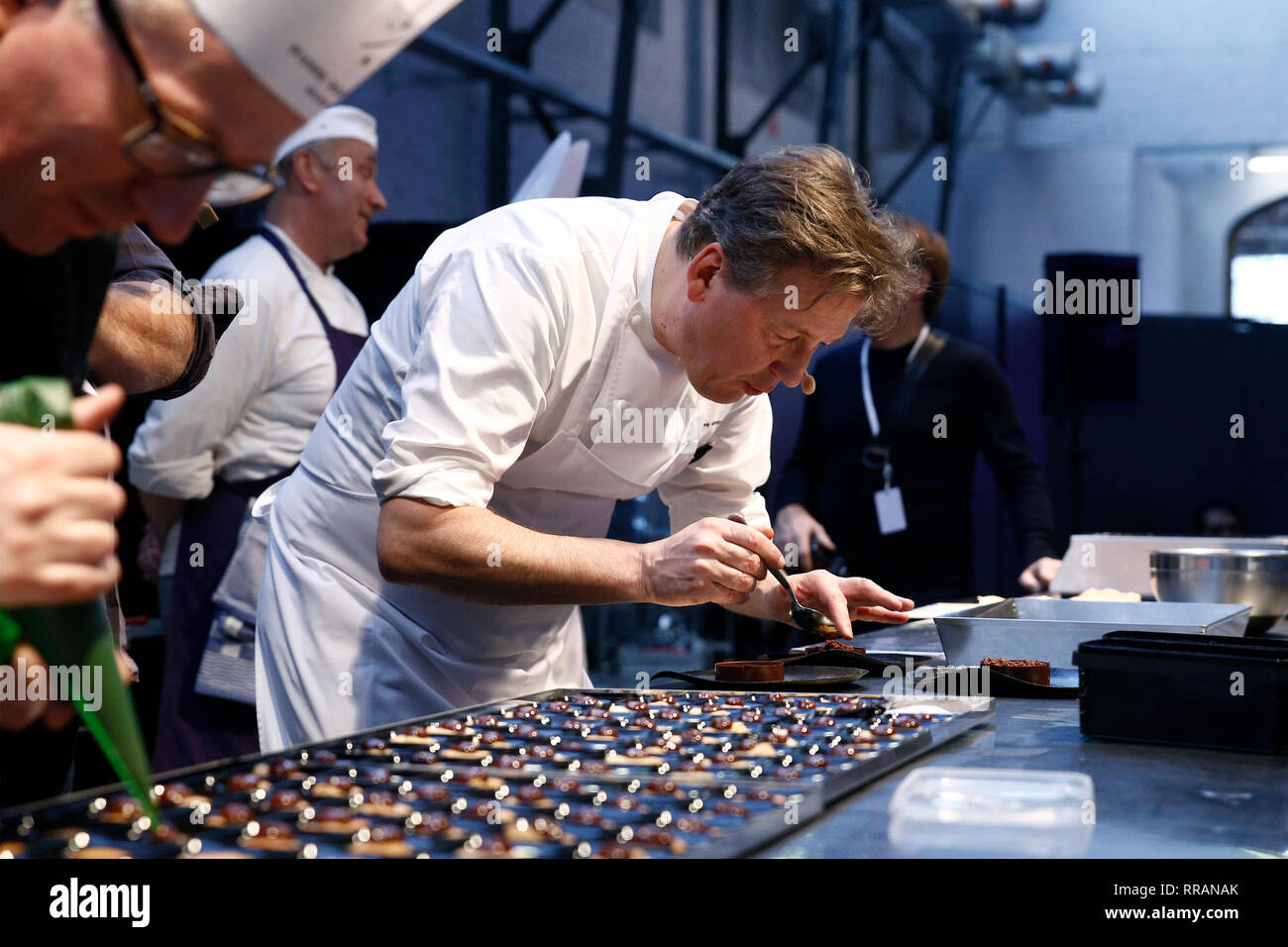 Brussels, Belgium. 24th Feb, 2019. Famous Belgian chocolatier Pierre Marcolini prepares chocolate dessert in Salon du Chocolat. Credit: ALEXANDROS MICHAILIDIS/Alamy Live News Stock Photo