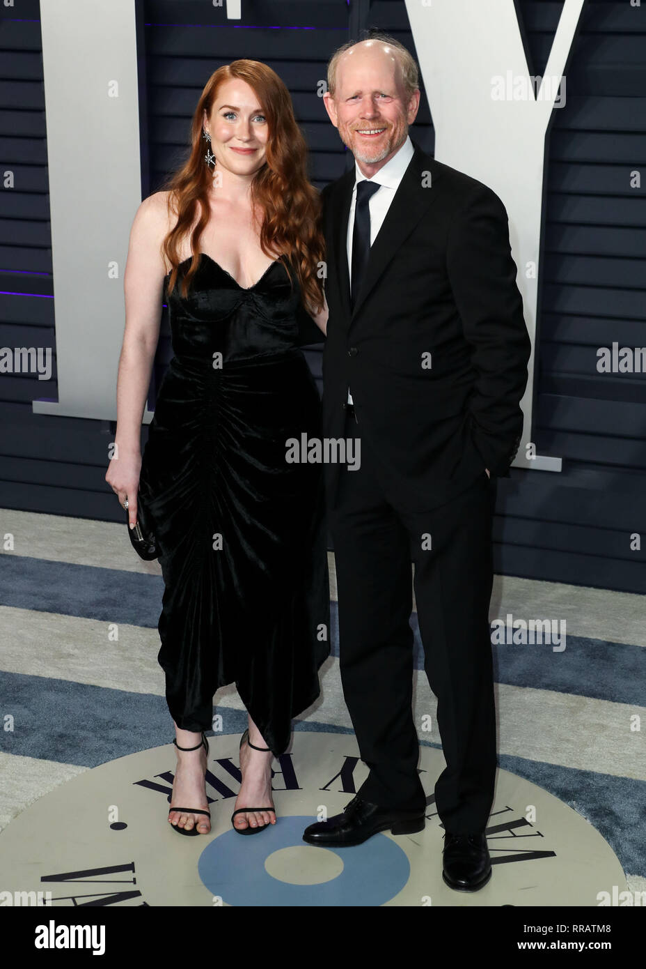 BEVERLY HILLS, LOS ANGELES, CA, USA - FEBRUARY 24: Paige Howard and father Ron Howard arrive at the 2019 Vanity Fair Oscar Party held at the Wallis Annenberg Center for the Performing Arts on February 24, 2019 in Beverly Hills, Los Angeles, California, United States. (Photo by Xavier Collin/Image Press Agency) Stock Photo
