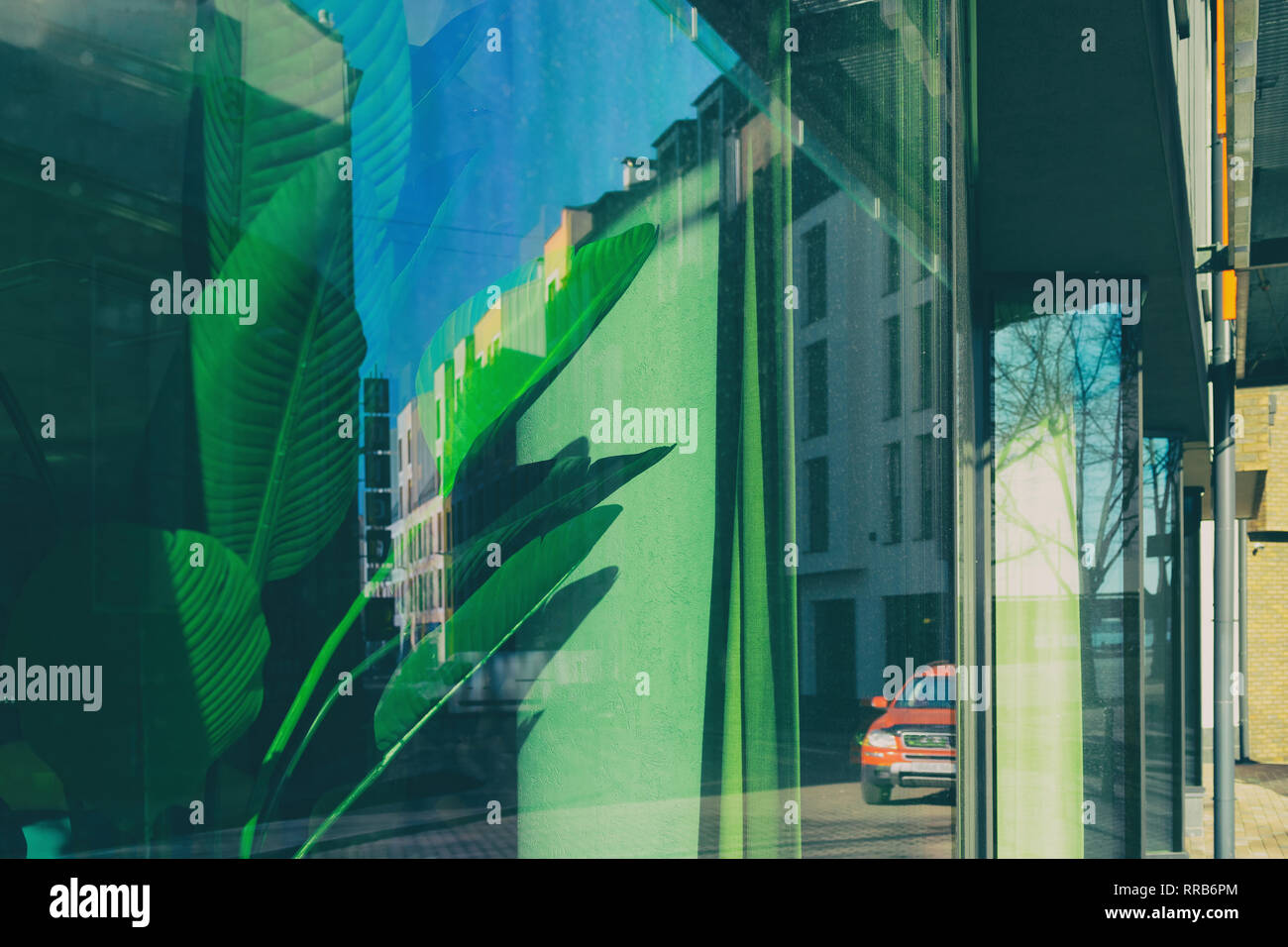 The reflection of the city buildings in the window Stock Photo - Alamy