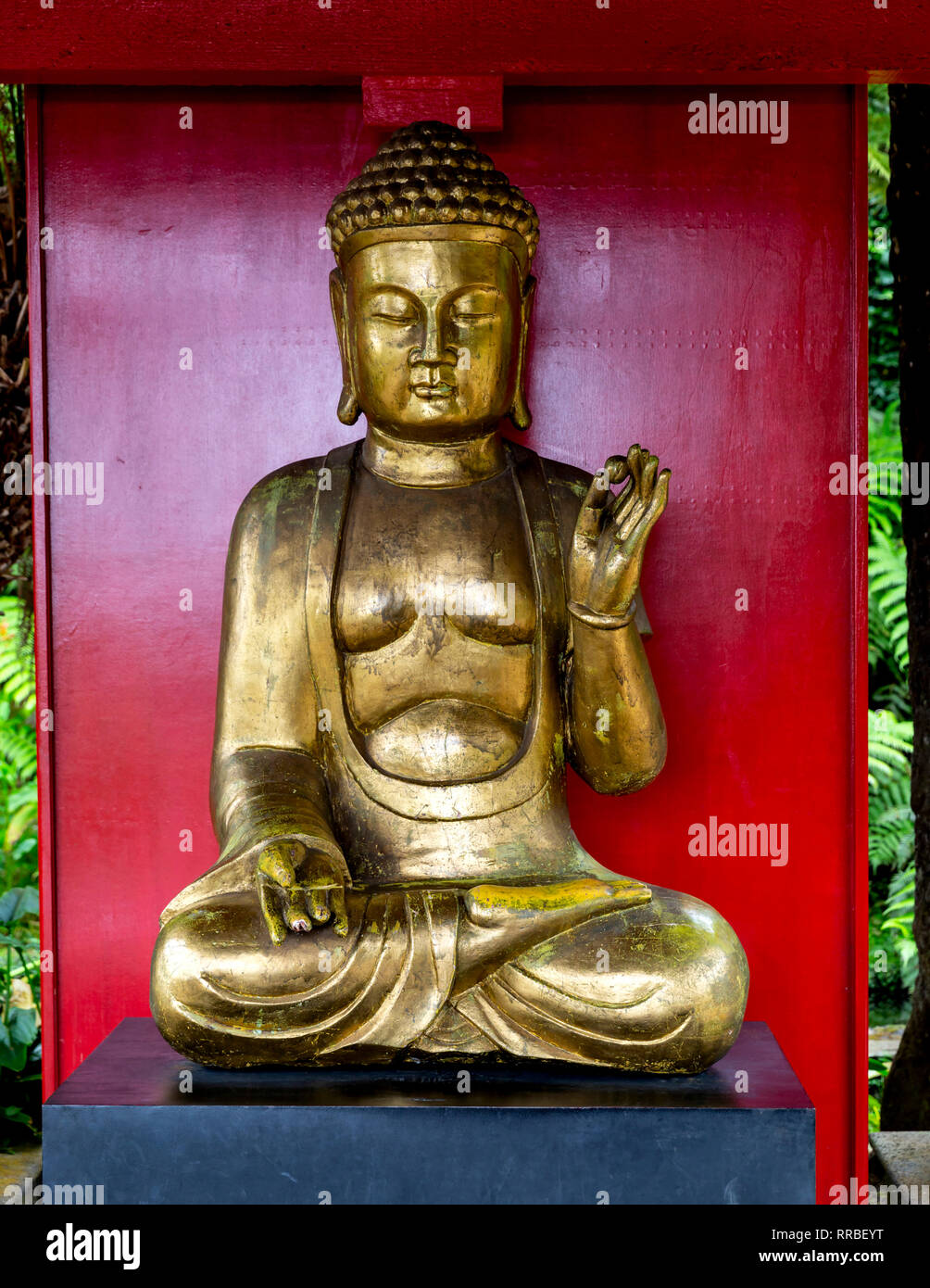 Golden Buddha statue in the Japanese garden, Monte Palace Tropical Gardens, Funchal, Madeira, Portugal. Stock Photo