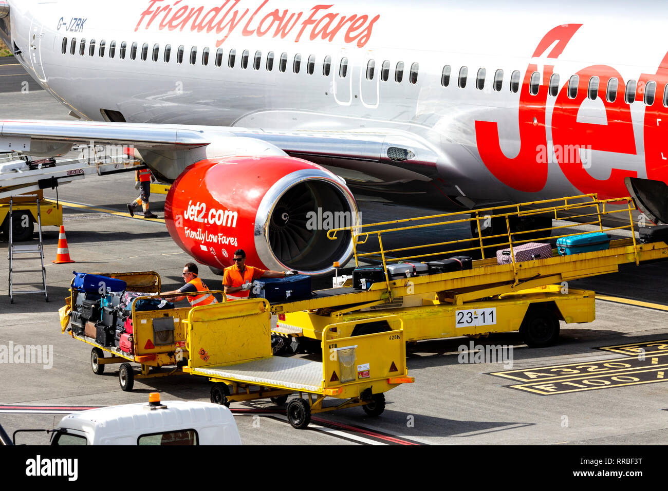 Luggage being loaded into the hold of a Jet2  Boeing 737 at Funchal airport, Madeira, Portugal. Stock Photo