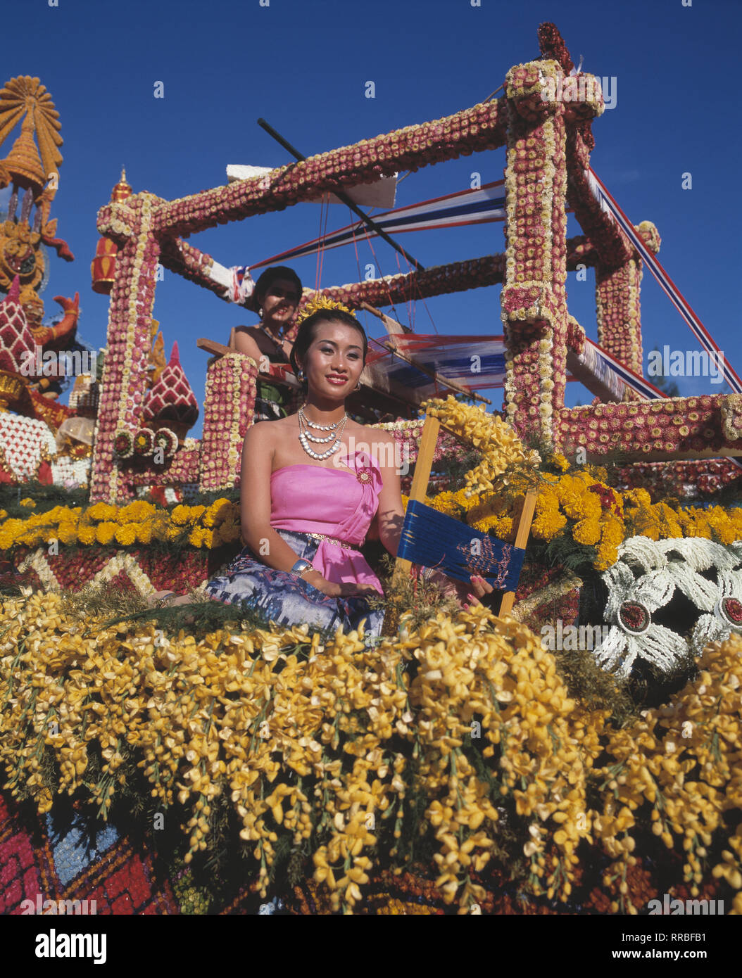 Thailand. Bangkok. Silom road festival float. Young woman in traditional costume. Stock Photo