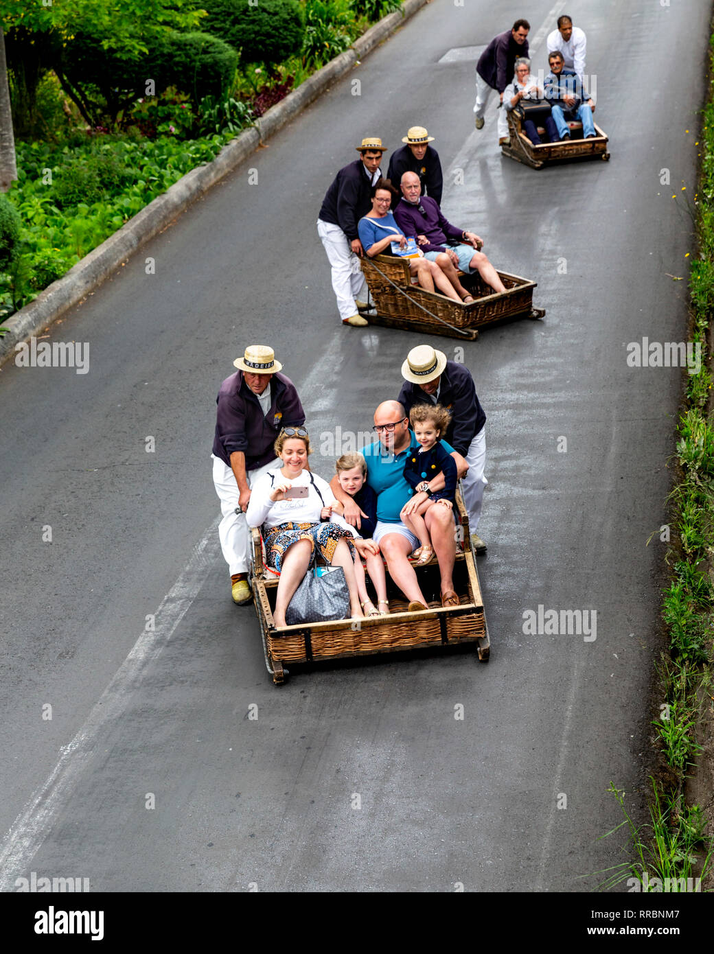 Tourists Taking A Traditional Toboggan Ride At Monte Funchal Madeira Portugal Stock Photo Alamy