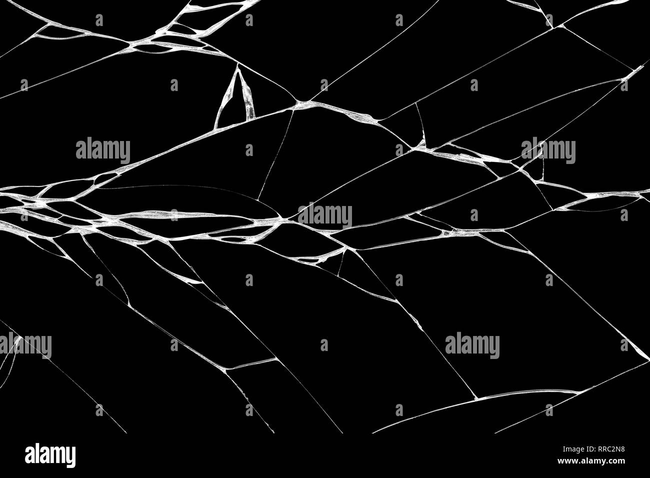 Close-up arts of patterns of wrinkle and cracks on touch screen display of smartphone caused by falling on black background Stock Photo