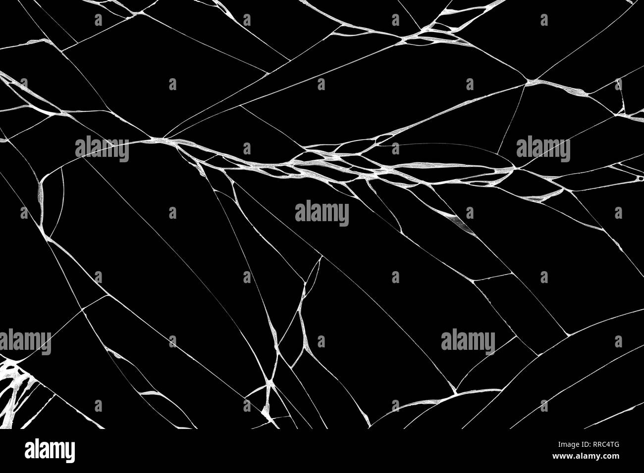 Close-up arts of patterns of wrinkle and cracks on touch screen display of smartphone caused by falling on black background Stock Photo