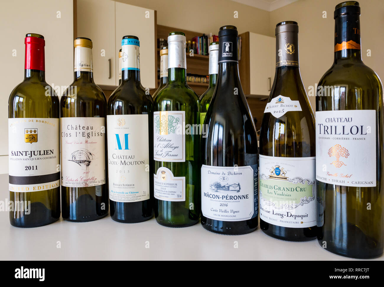 Empty French fine wine bottles Saint Julien, Chateau Clos l'Egise, Croix-Mouton, de l'Abbaye de Saint Ferme, Macon-Peronne, Chablis Grand Cru Trillol Stock Photo