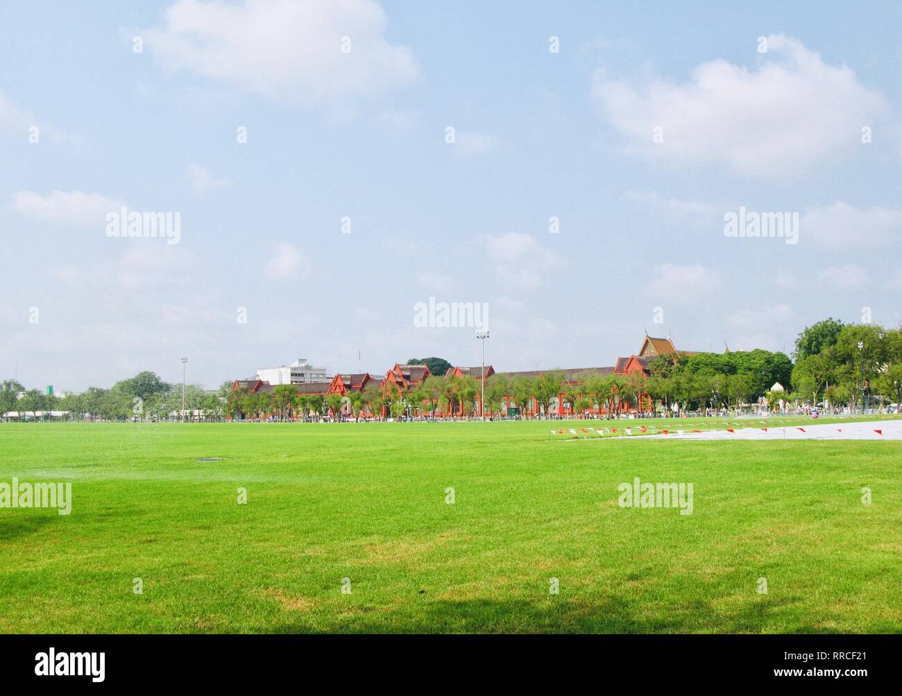 Landscape of The Lawn At Royal Plaza or Sanam Luang in Front of Wat Mahathat Yuwaratrangsarit Temple at Bangkok, Thailand. A Centre for The Study of B Stock Photo