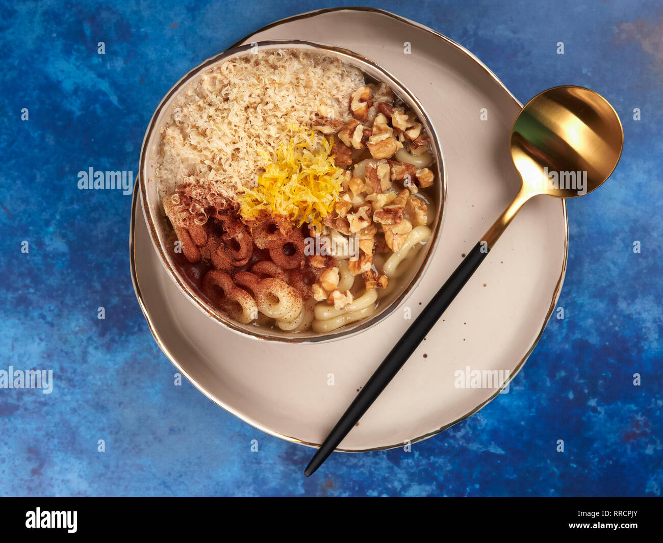 Romanian mucenici or macinici: figure eight shaped pasta, boiled in water with sugar, cinnamon and crushed nuts. Traditional dessert for the Christian Stock Photo