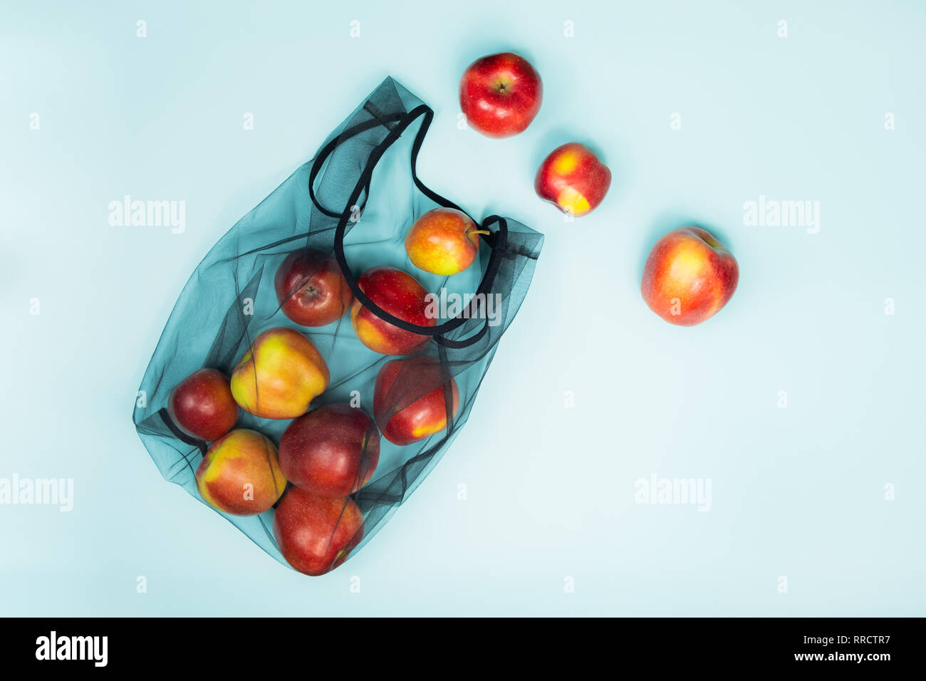 Top view of apples in a reusable string bag. Sustainable eco packaging ...