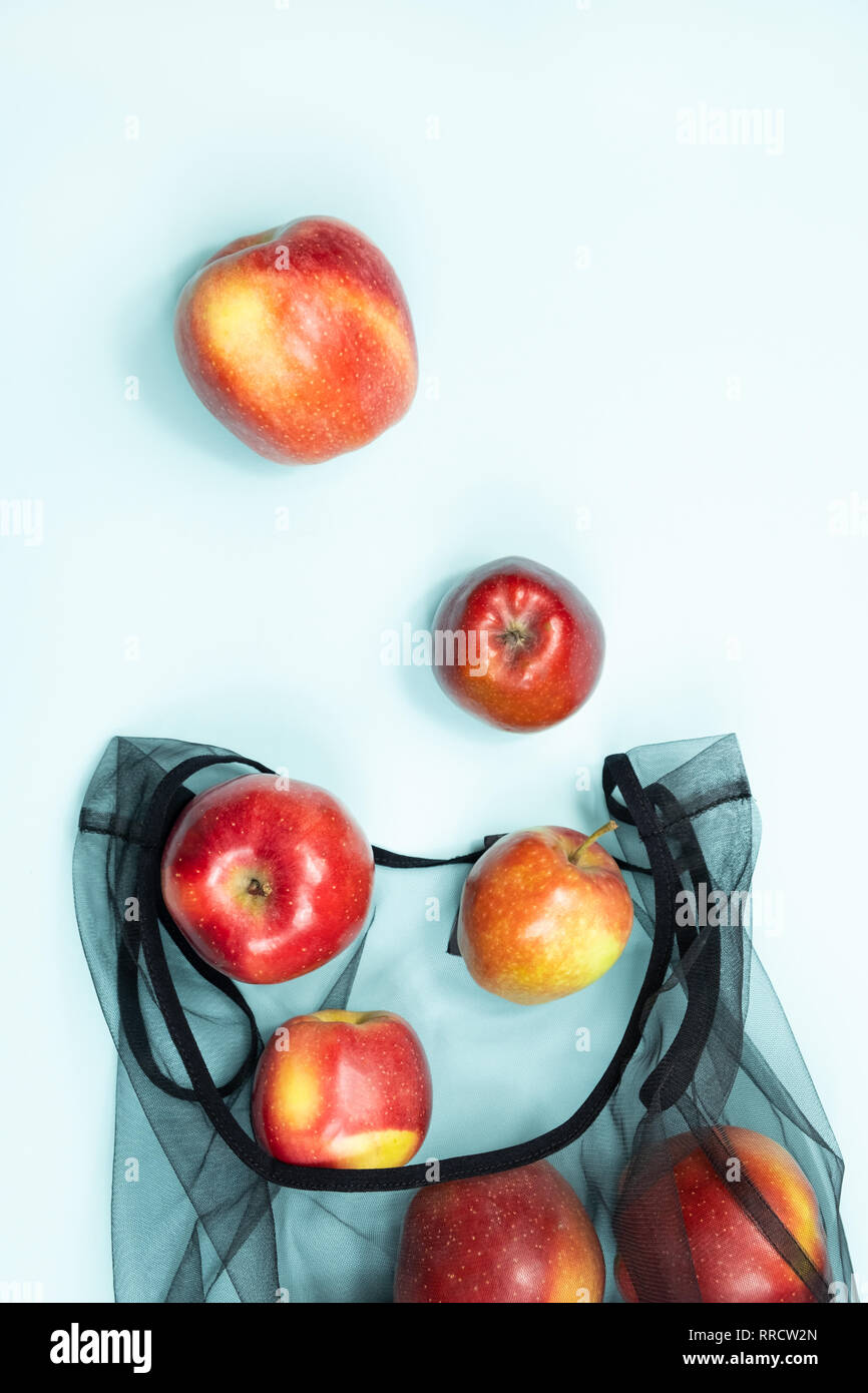 Top view of apples in a reusable string bag. Sustainable eco packaging ...