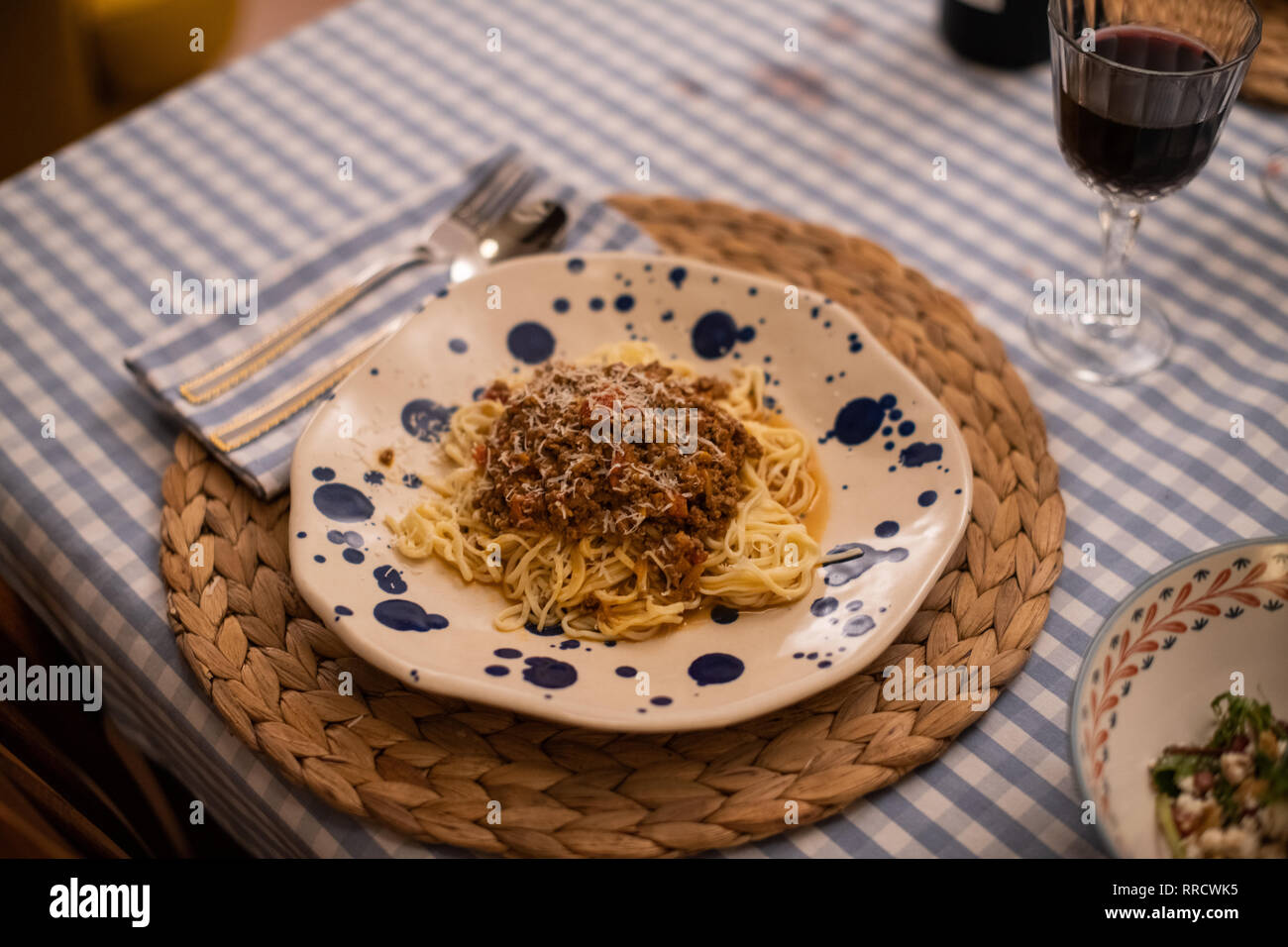 spaghetti bolognese served with wine Stock Photo Alamy