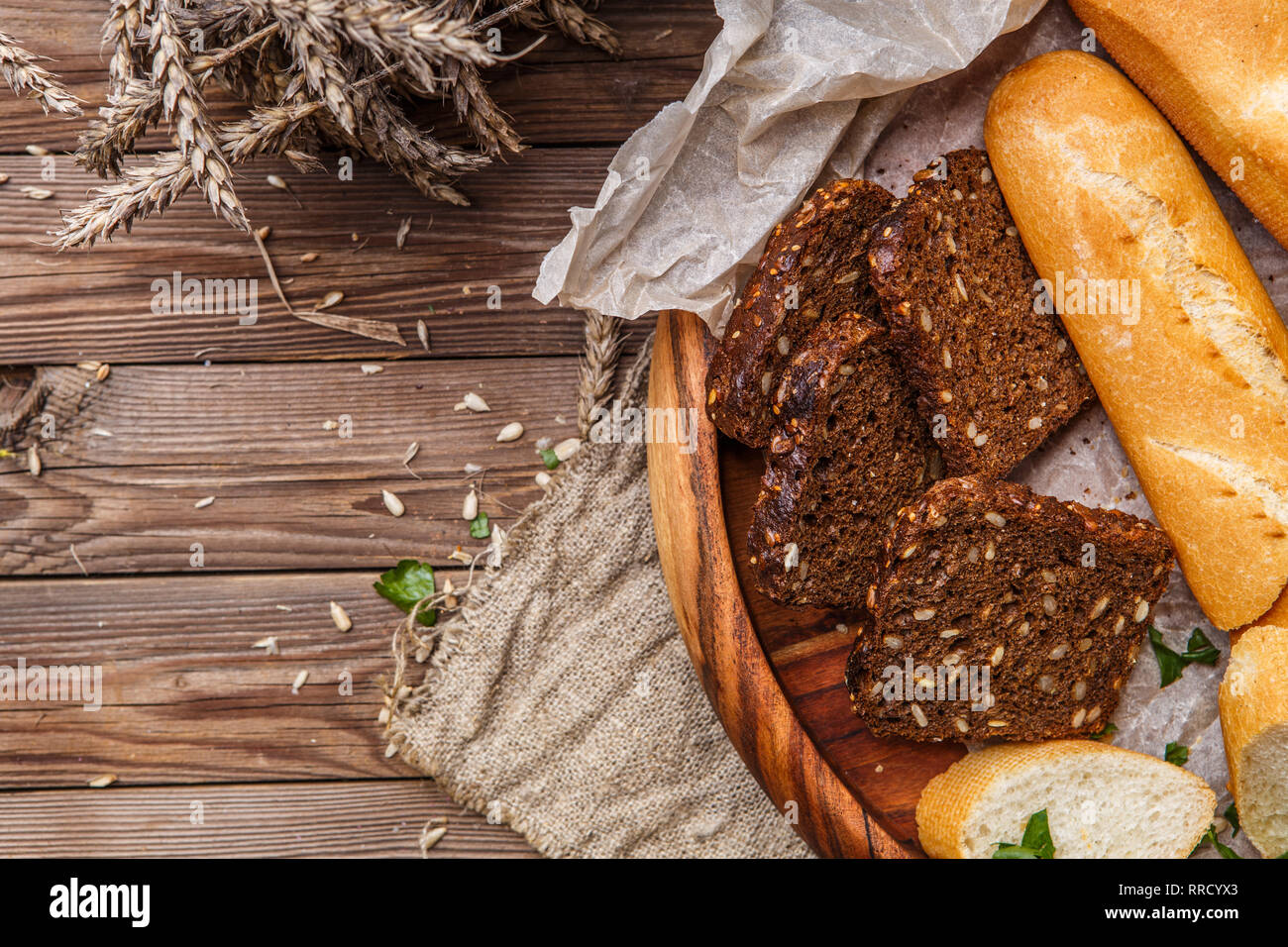 Useful bread in wooden bowl Stock Photo
