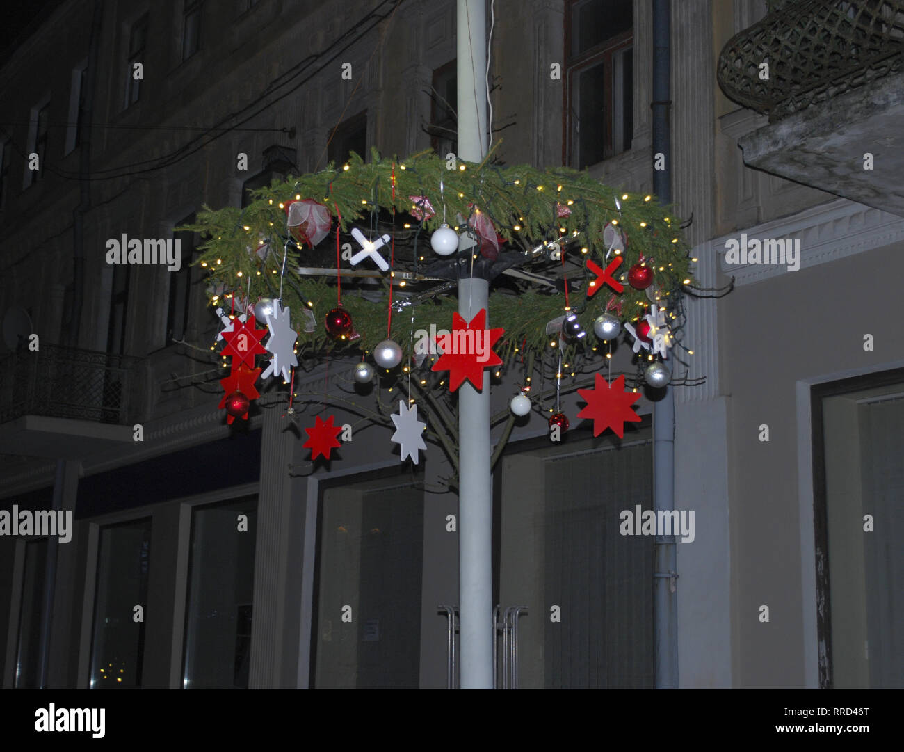 Christmas wreath. Christmas decorations on the street at night. Stock Photo