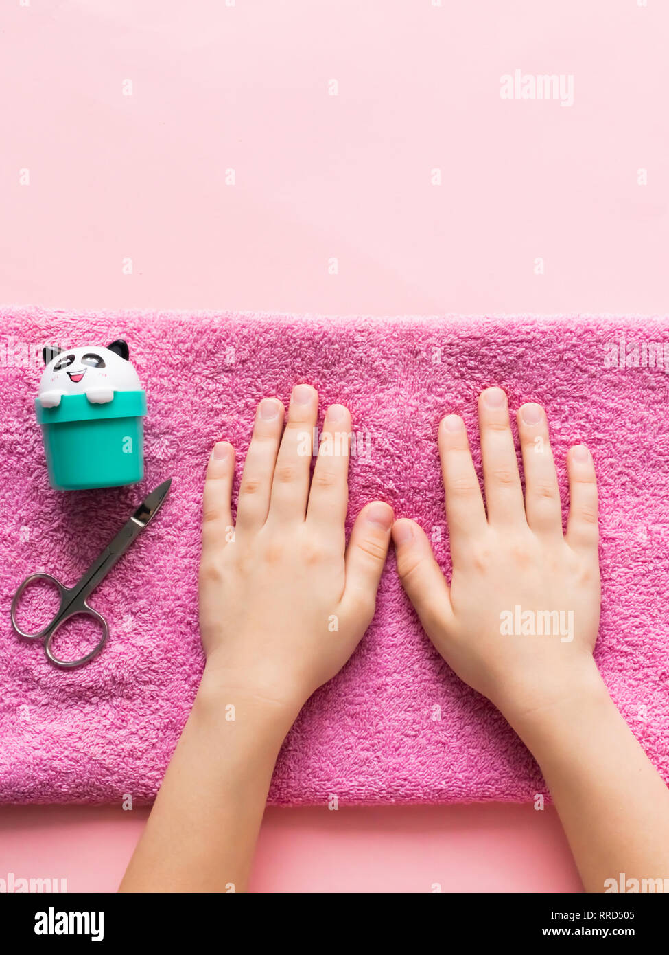 https://c8.alamy.com/comp/RRD505/spa-treatments-for-hand-skin-and-nails-for-children-young-girls-hands-are-on-pink-soft-towel-beauty-and-care-concept-RRD505.jpg