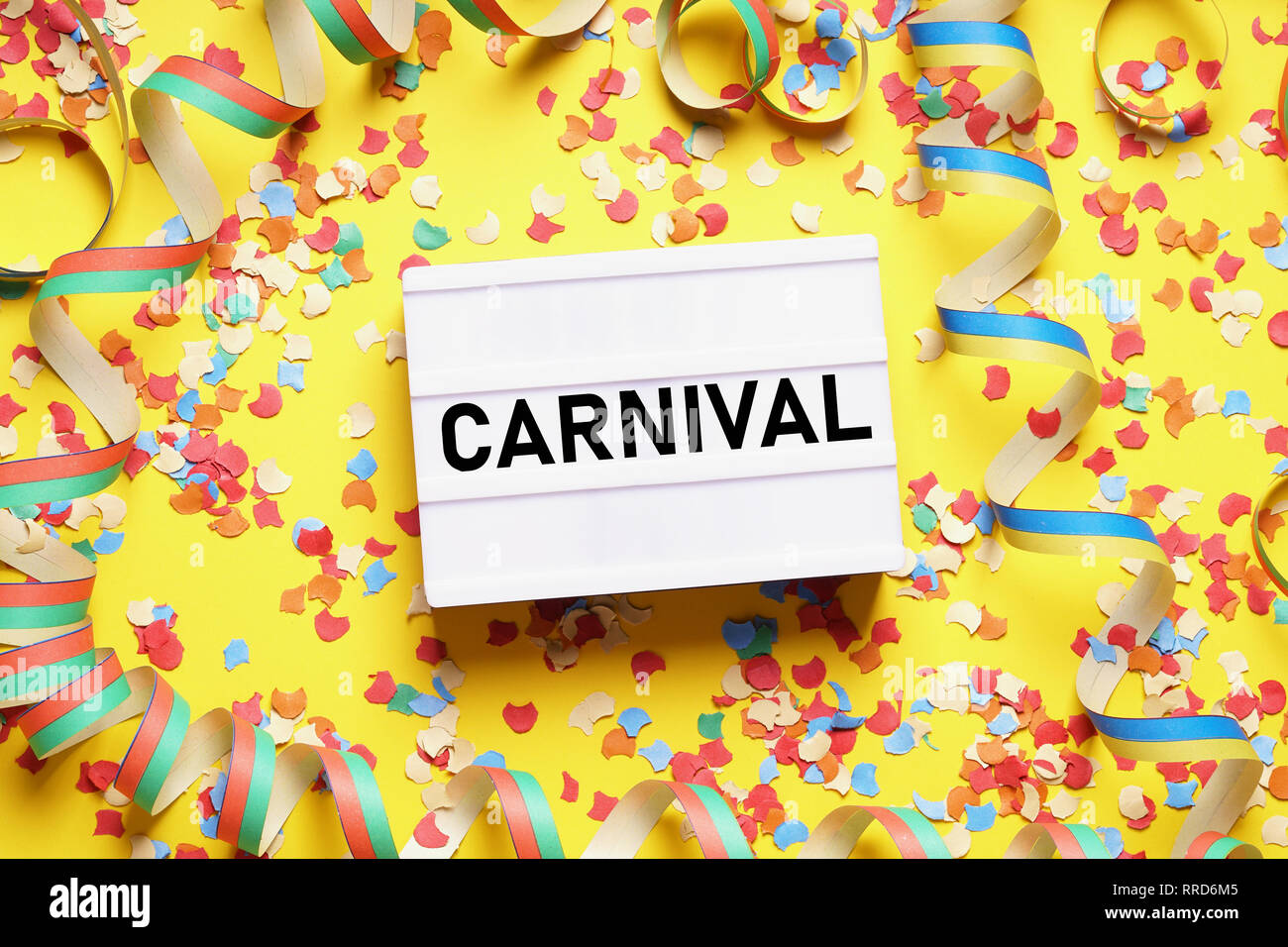 carnival flat lay with confetti and streamers Stock Photo