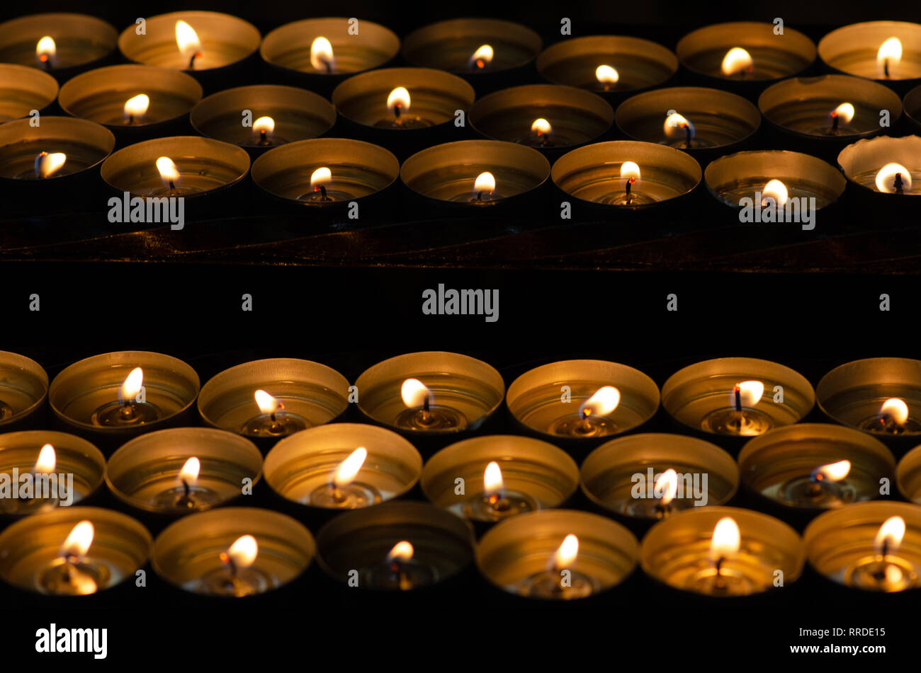 Row of votive candles in dark church hires stock photography and images Alamy