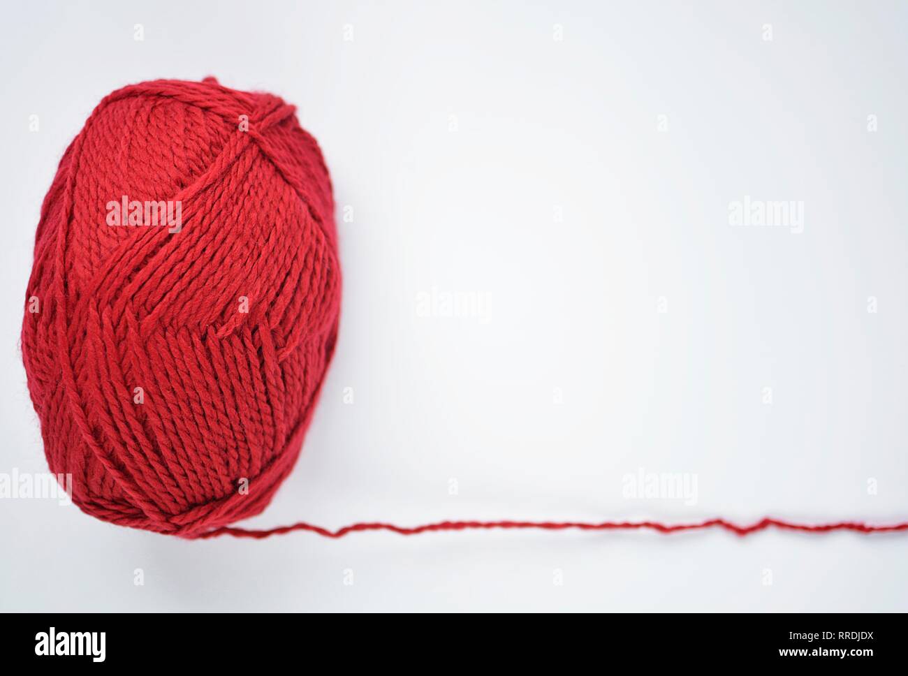 knot of red knitting yarn Stock Photo