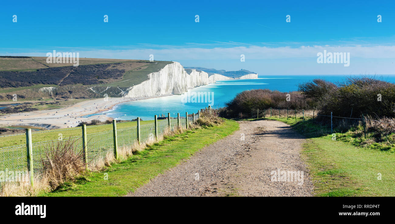 Walk to Cuckmere Haven beach near Seaford, East Sussex, England. South Downs National park. View of blue sea, cliffs, long photo banner selective focus Stock Photo